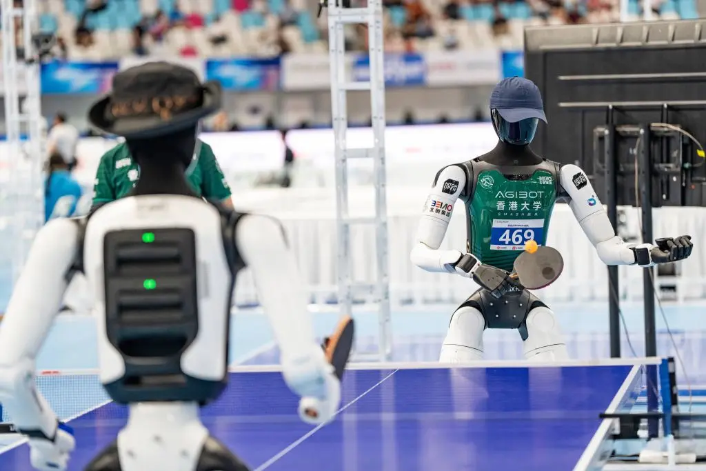 The Battery Challenge Behind the 2026 World Humanoid Robot Games 2 robot playing ping-pong