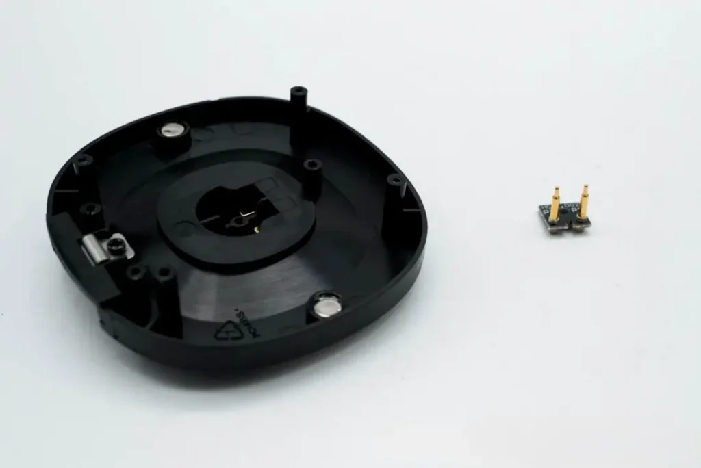 Smart Ring Charging Methods: 3 Main Solutions Explained 2 Charging Contacts on the Charging Dock Post of the RingConn Charging Case